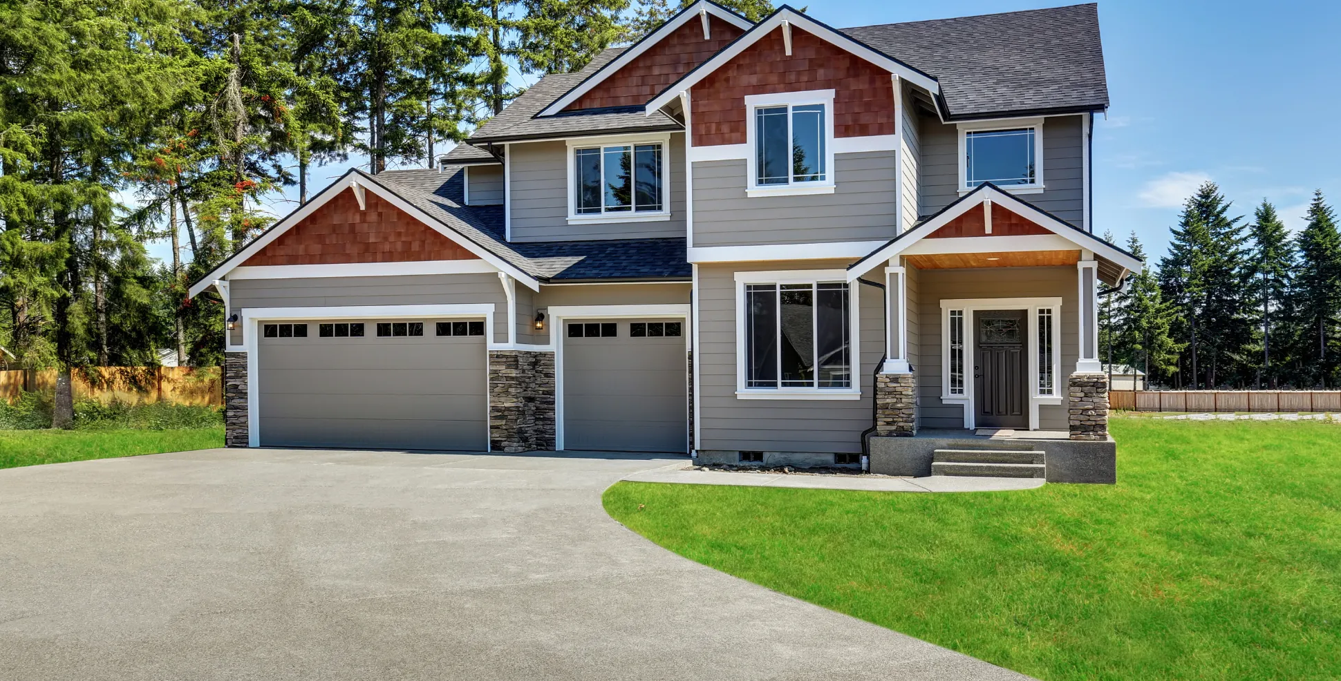 Finished residential concrete driveway and front entry walkway installed at a modern home in Los Angeles