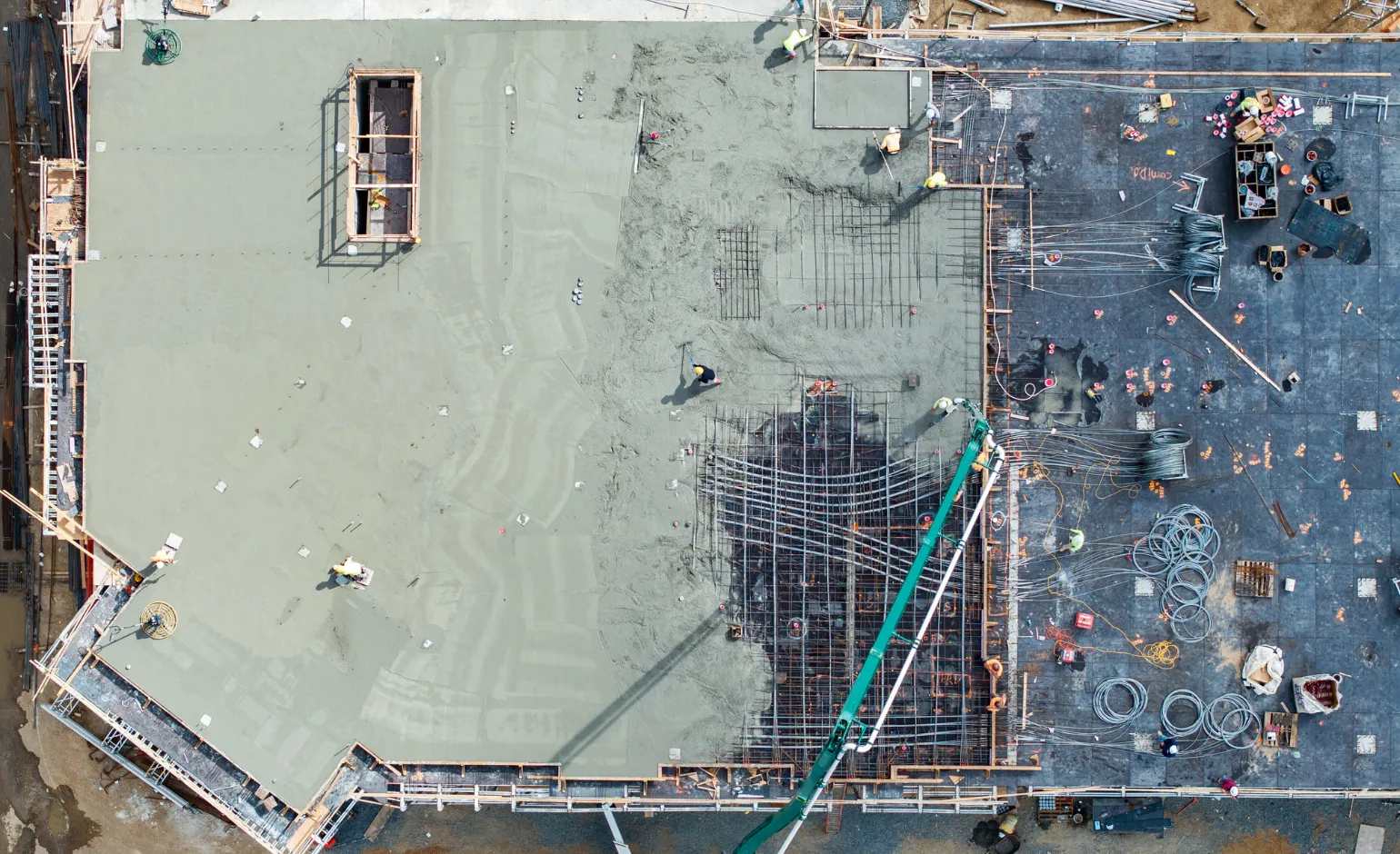 Concrete Pro LA structural concrete crew pouring reinforced slabs from an aerial view